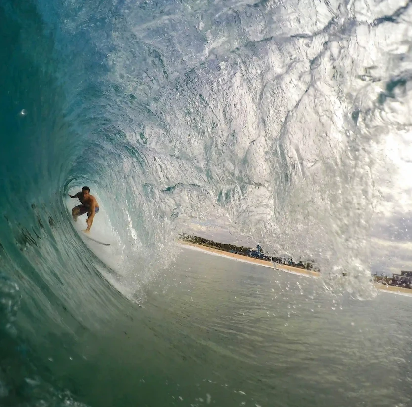 Surfer riding inside a hollow barrel wave at Magnific Rock in Popoyo, Nicaragua