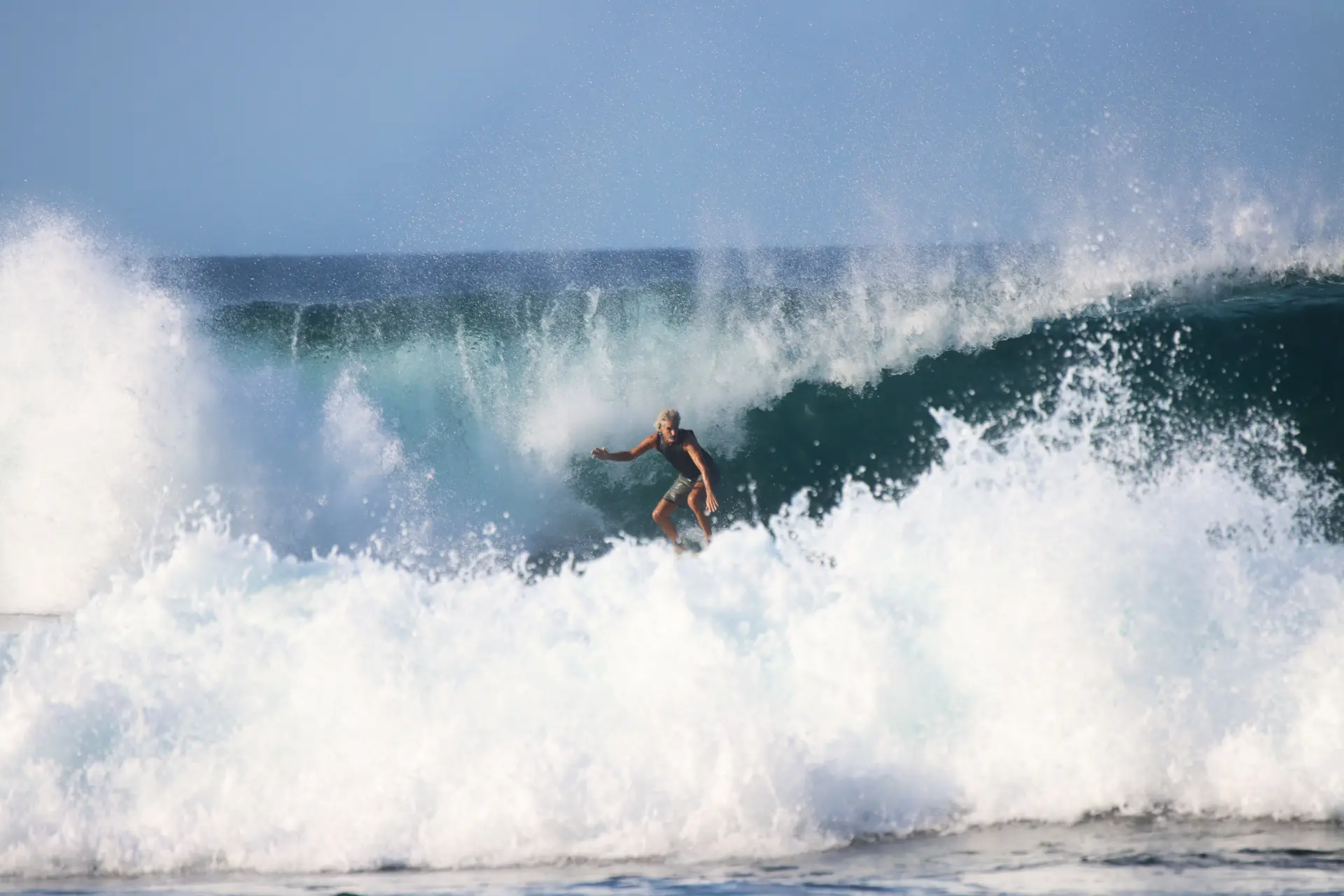 old man catching a wave at popoyo nicaragua surf camp