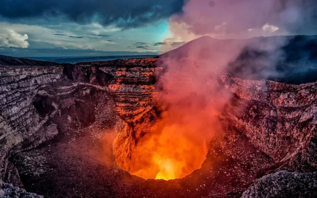 active lava lake glowing at night inside Masaya volcano Nicaragua viewed from the crater rim