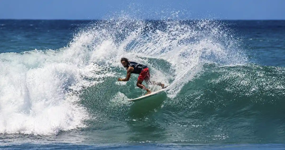 surfer on a clean A-frame reef break wave at Popoyo Nicaragua in offshore wind conditions